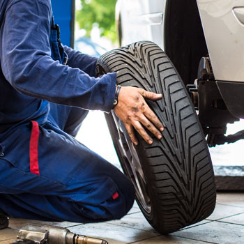 A Mechanic Changing a Tire